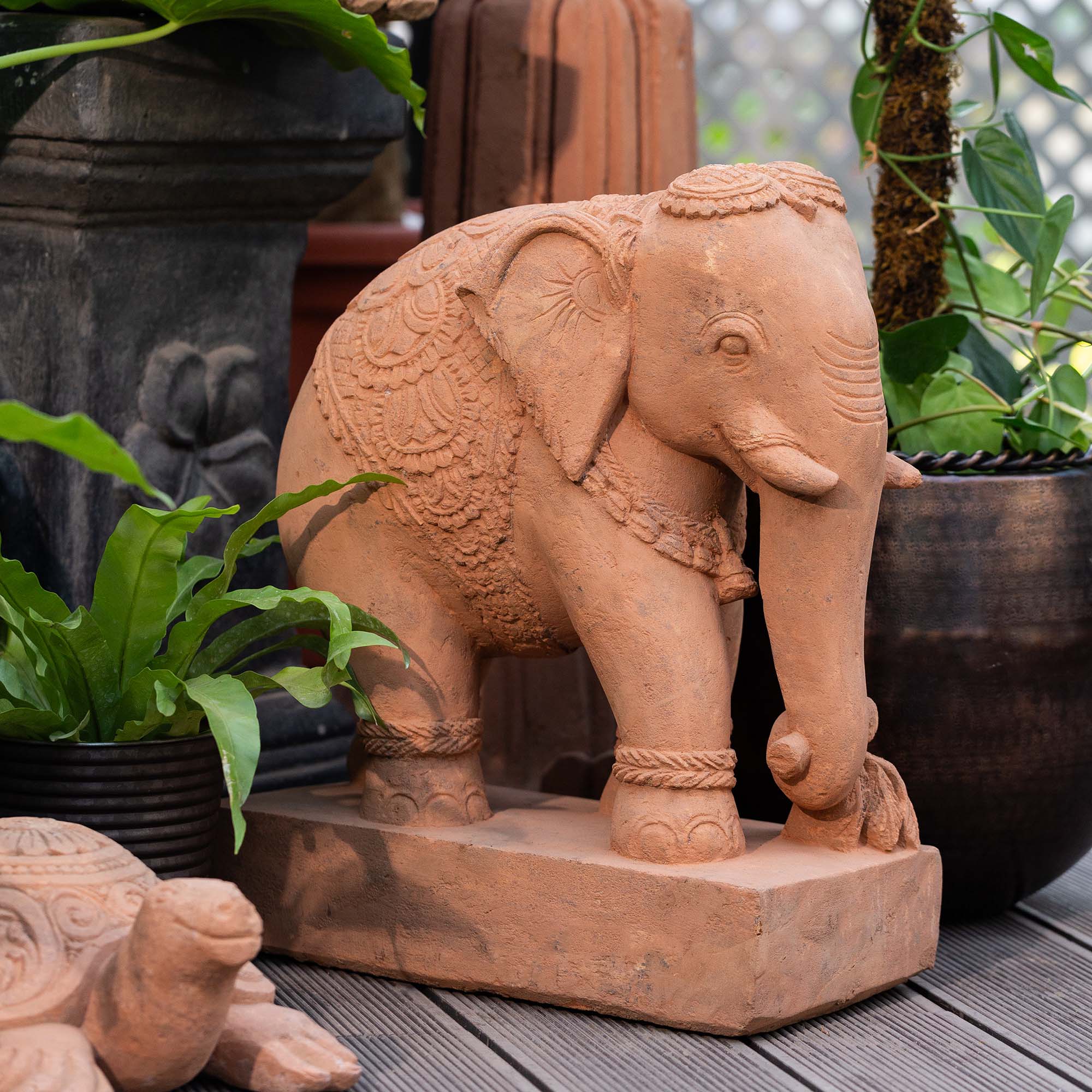 Intricate terracotta elephant statue, handcrafted from Ubesh sandstone.